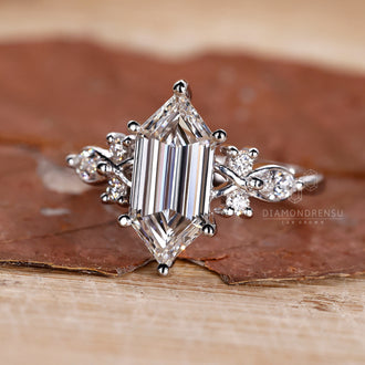 Elongated hexagon diamond engagement ring design.