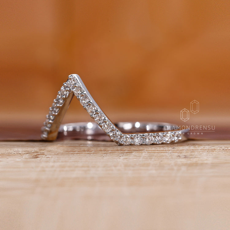 Prong set wedding band offering secure and stylish brilliance.