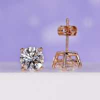 Round diamond stud earrings featuring a 3 carat diamond design.