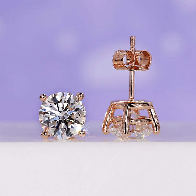 Round diamond stud earrings featuring a 3 carat diamond design.