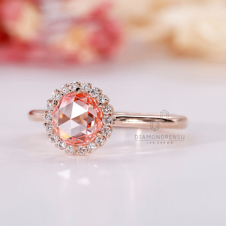 Halo Engagement Ring with sparkling pink diamonds.