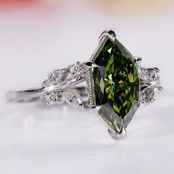 Dutch marquise ring and marquise and round sidestones in white gold.
