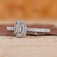 Round cut diamond ring with emerald cut engagement ring for added brilliance.