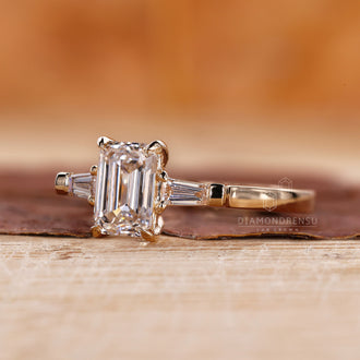 Yellow Gold Ring with emerald cut diamonds for a classic look.
