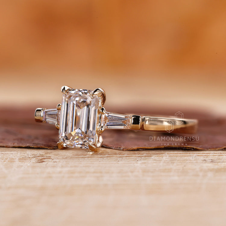Yellow Gold Ring with emerald cut diamonds for a classic look.