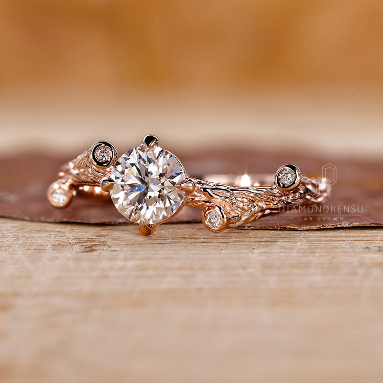 Engagement ring with round side stones, adding extra shimmer and elegance.