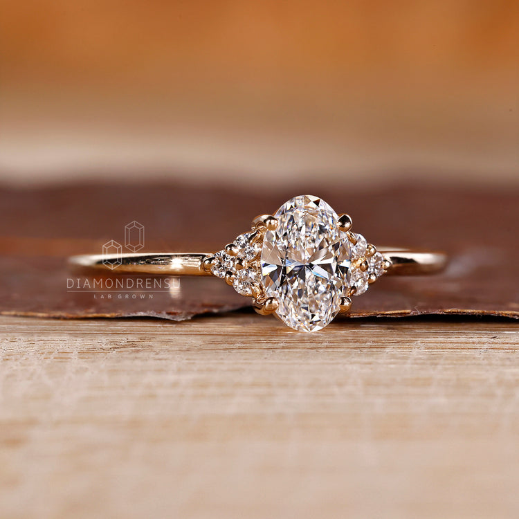 Round side stone ring paired with oval diamond engagement ring.