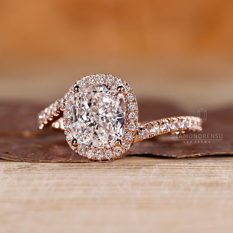 Pave setting ring featuring a cushion cut.