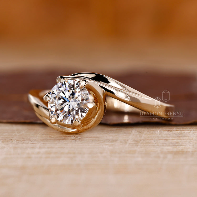 Handmade ring with solitaire diamond engagement ring.