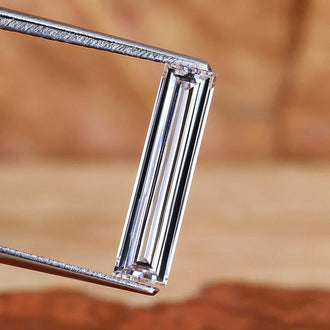 Long baguette cut diamond with 0.76 carat weight.