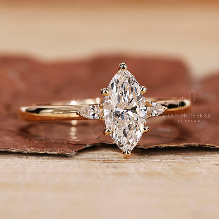 Three Stone Ring with brilliant marquise diamonds for added sparkle.
