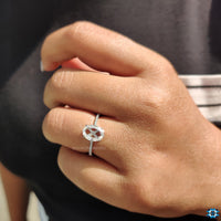 The hidden halo setting adds extra brilliance from beneath the stone.