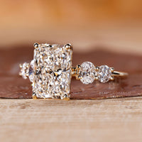 Oval ring featuring radiant cut diamonds for a classic and timeless look.