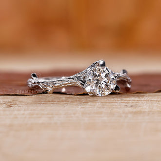 IGI certified round cut diamond ring set in a nature-inspired white gold band with handmade branch details