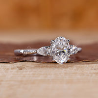 Oval diamond ring in a 4 prong claw setting.