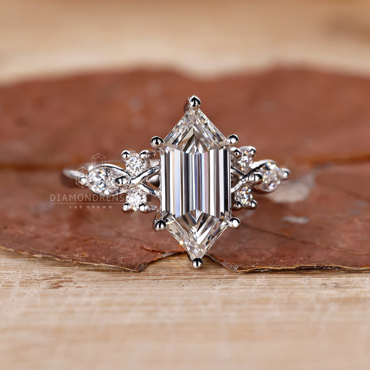 White gold engagement ring with marquise side stones.