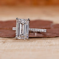 White Gold Ring with a classic emerald cut diamond centerpiece.