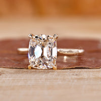 Cathedral ring with old mine cushion cut diamond.