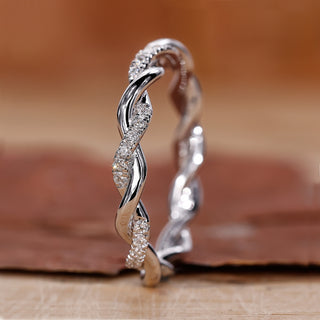 Twisted pave wedding band with a handcrafted look.