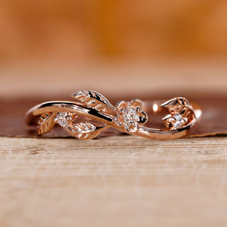 Leaf diamond wedding band in rose gold with round cut stones.