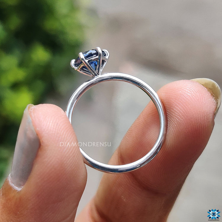 White gold engagement ring with round moissanite.
