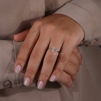 Elegant oval diamond engagement ring with precision.