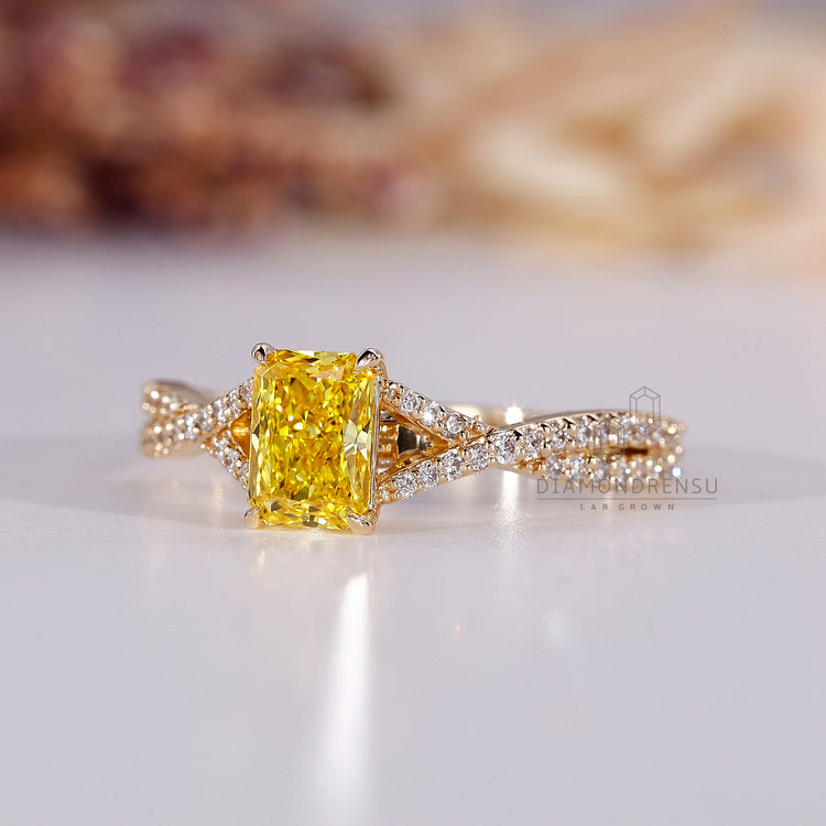 Twisted pave ring featuring a radiant cut engagement ring for extra shine.