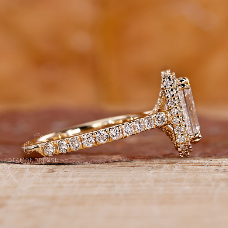 Lab grown diamond emerald halo engagement ring.