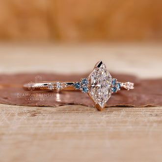 Custom engagement ring featuring a lab grown diamond and round cut side diamonds for extra sparkle.