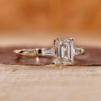 Tapered Baguette Ring with elegant emerald cut diamonds.