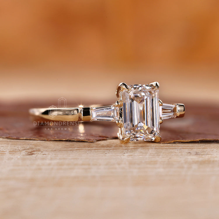 Tapered Baguette Ring with elegant emerald cut diamonds.