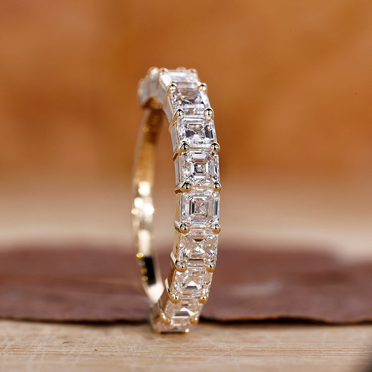 Asscher cut wedding band in yellow gold.