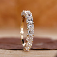 Asscher cut wedding band in yellow gold.