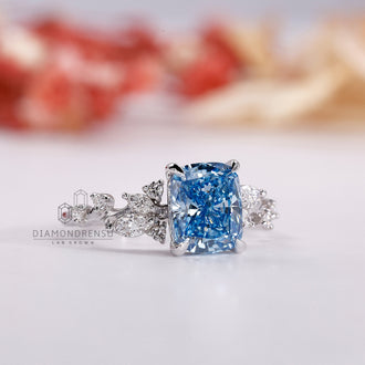 Marquise and round side stone ring set in a classic white gold engagement ring.