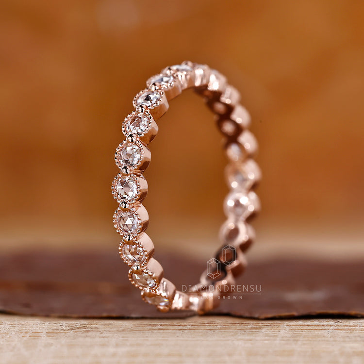 Diamondrensu rose gold shared prong band.