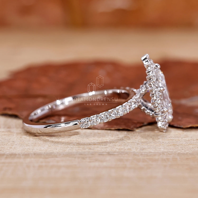 Halo Ring with sparkling diamonds surrounding the center stone.