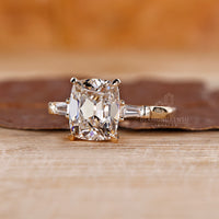 Basket setting engagement ring featuring a cushion cut diamond, providing both security and style.