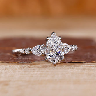 V shaped prong setting pear diamond engagement ring.