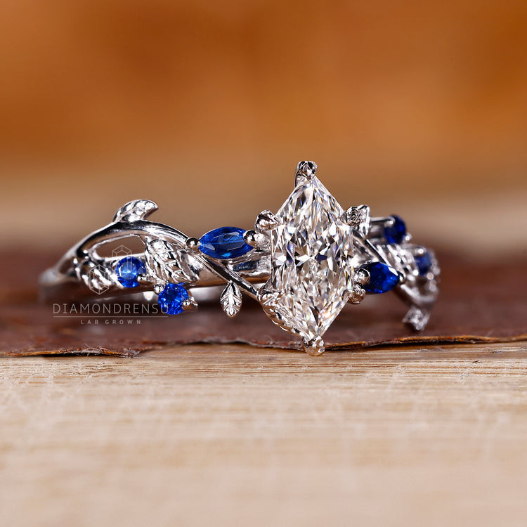 Marquise and round side stone ring with filigree