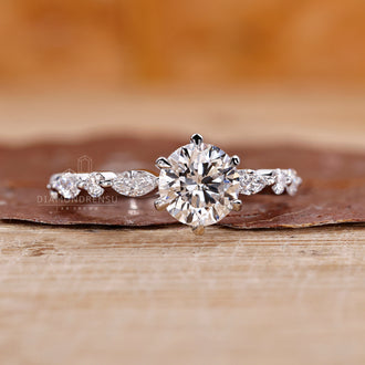 Marquise and round diamond blend beautifully in this ring.