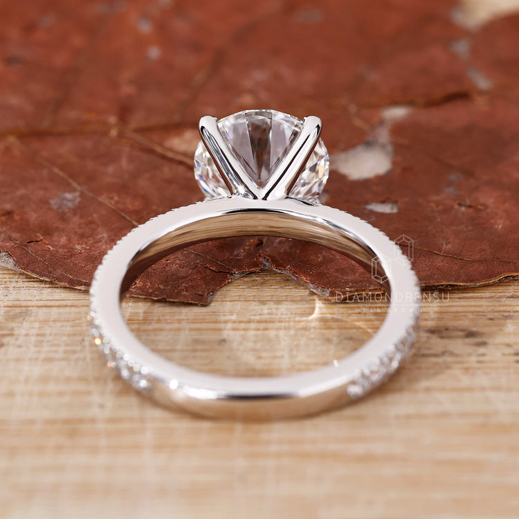 Round Cut Diamond Ring set in a gold pave setting.