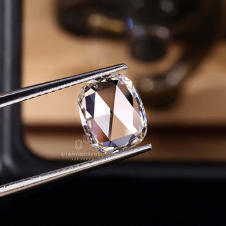 Lab created diamond in antique flat cushion cut style.