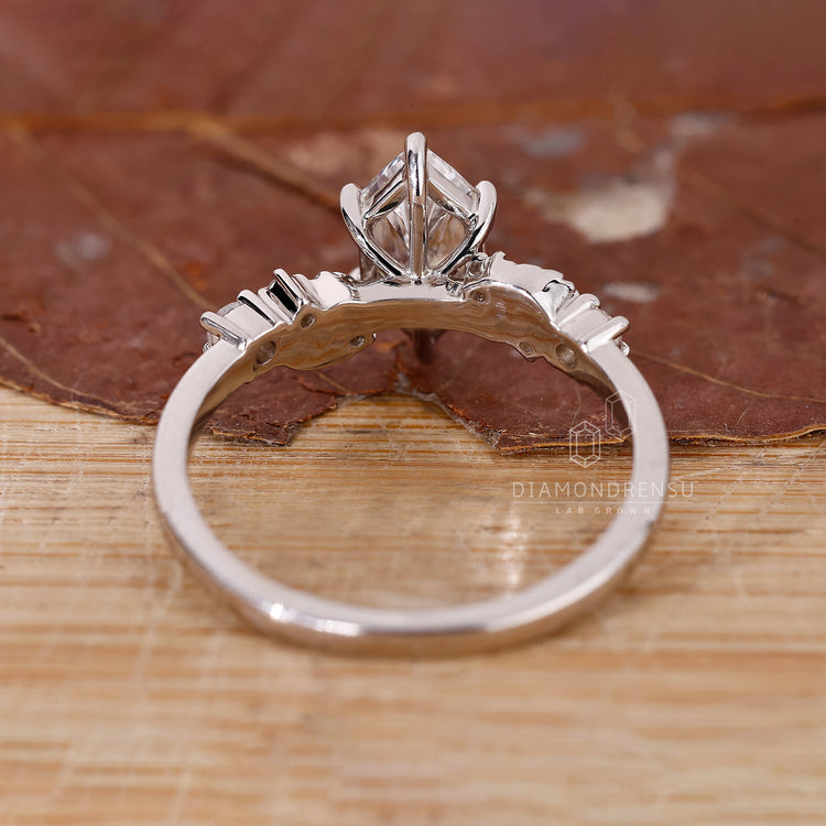 Muse ring white gold engagement ring round sidestones