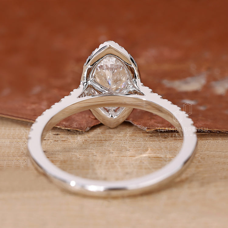 Halo setting and prong setting work well together in this engagement ring.
