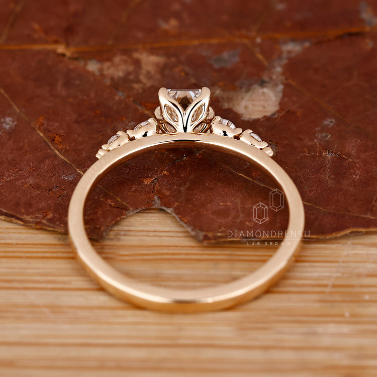 Round diamond side stone engagement ring.