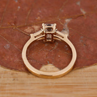 Claw Prongs setting on an emerald cut diamond ring for security.