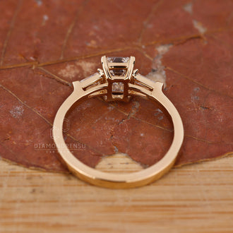 Claw Prongs setting on an emerald cut diamond ring for security.