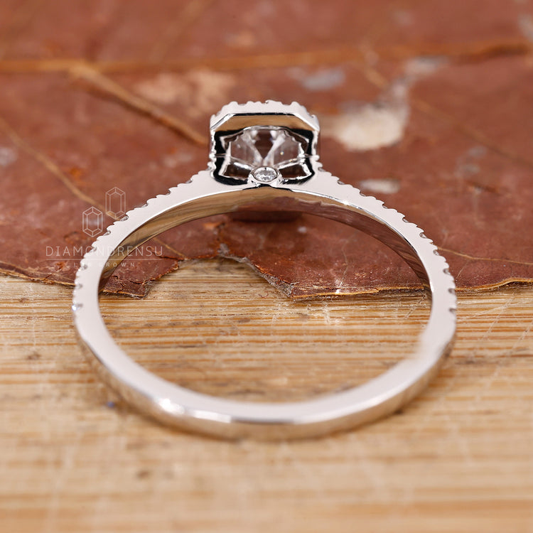 White gold jewellery ring with an emerald cut engagement ring for a modern feel.
