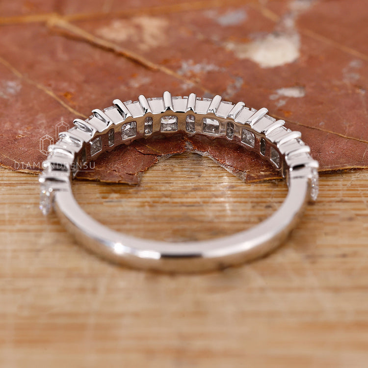 Prong setting wedding band for maximum brilliance.