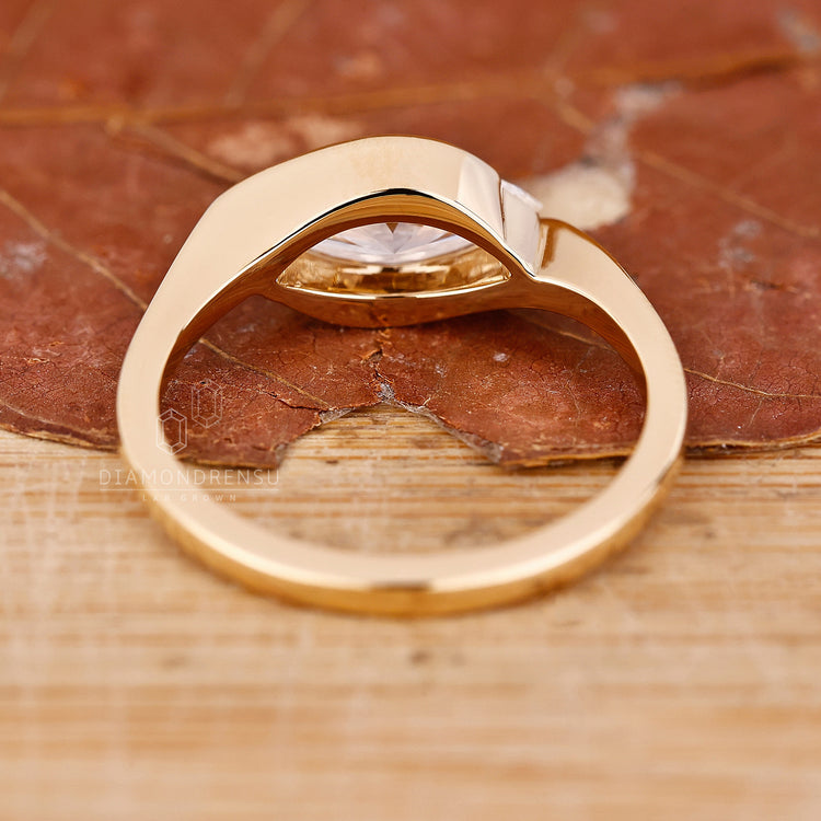 Handmade east west marquise engagement ring crafted with precision and style